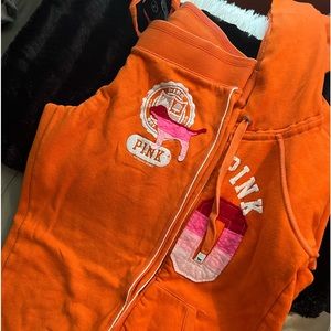 Women Victoria Secret Pink jogging suit in orange. Good condition, price to sell